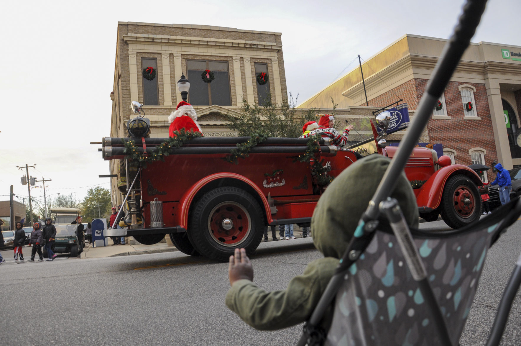 Boy waves at Santa.jpg